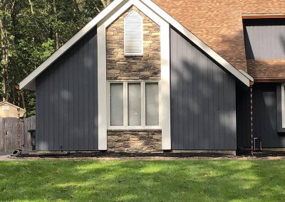 A single part of a larger navy-paneled house