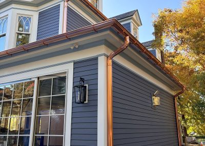 blue house with copper gutters in haddonfield nj