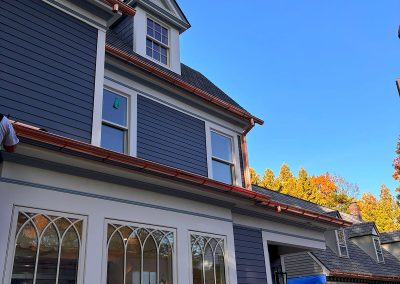 blue house with copper gutters in haddonfield nj