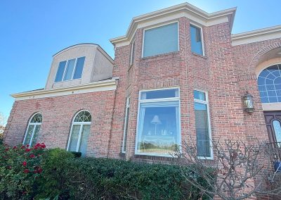 front view of house in shamong nj with garden bed and white seamless gutters van's rain gutters south jersey