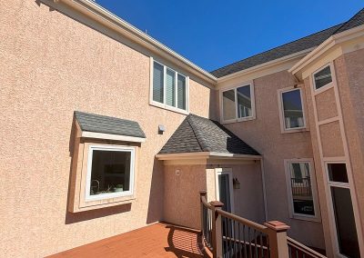 view of back deck and stairs of home with installed seamless gutters in white shamong nj van's rain gutters south jersey